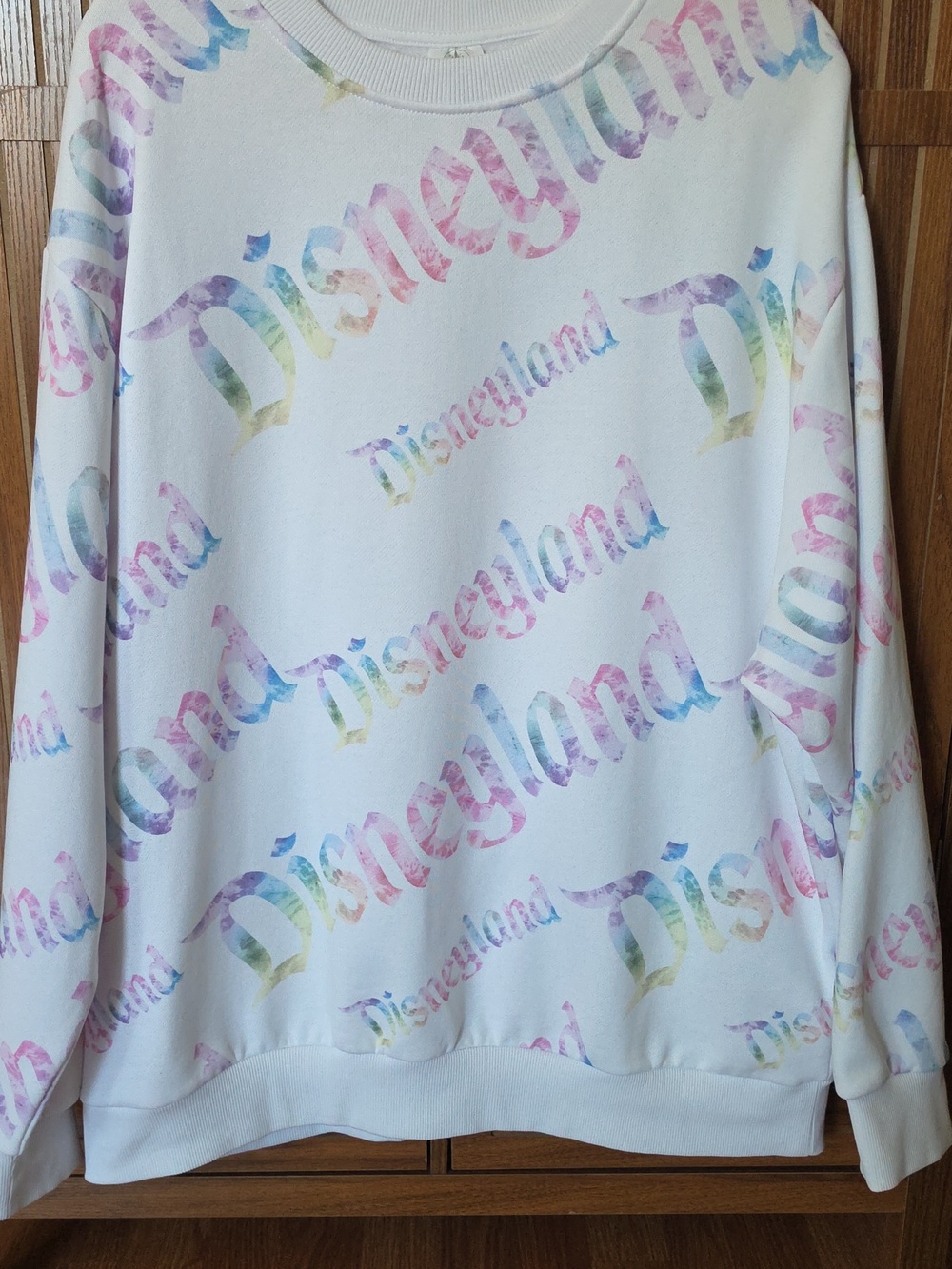 NWOT Disney White Crewneck Sweatshirt with Pastel Rainbow 'Disneyland' Print